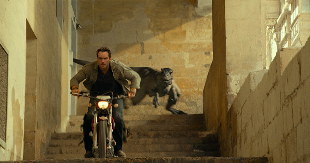 The chase involving the Velociraptors combined plate photography from Malta and Chris Pratt riding a stationary motorbike on a massive rolling road in the U.K.