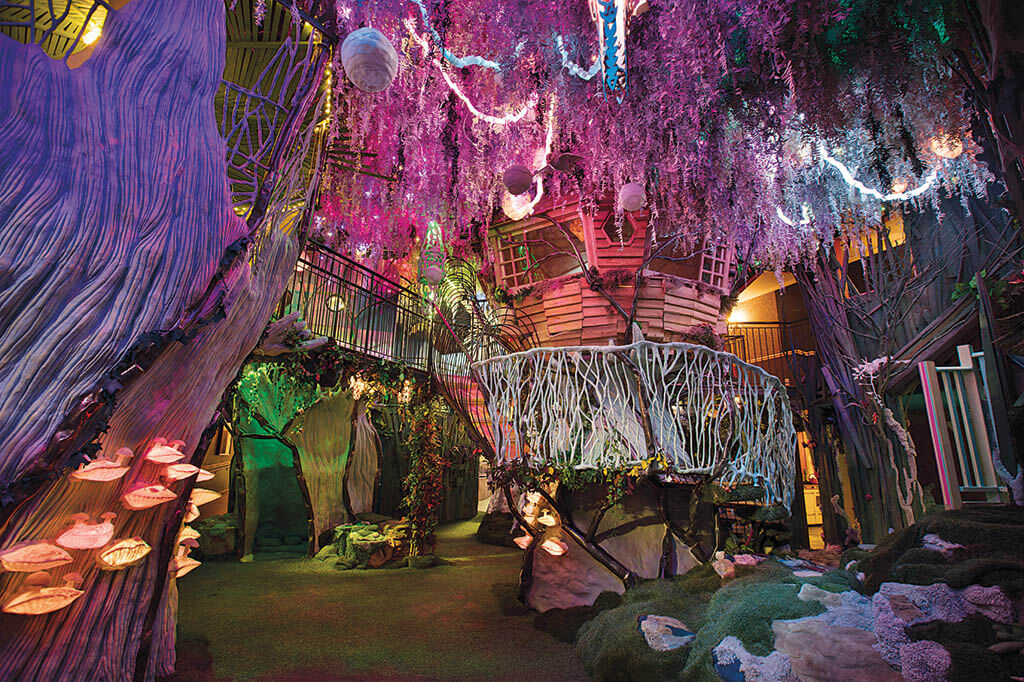 House of Eternal Return has an otherworldly tree house and backyard along with 70 rooms of immersive art. Game of Thrones writer George R.R. Martin purchased the site for this first permanent Meow Wolf attraction. (Photo: Kate Russell. Image courtesy of Meow Wolf)