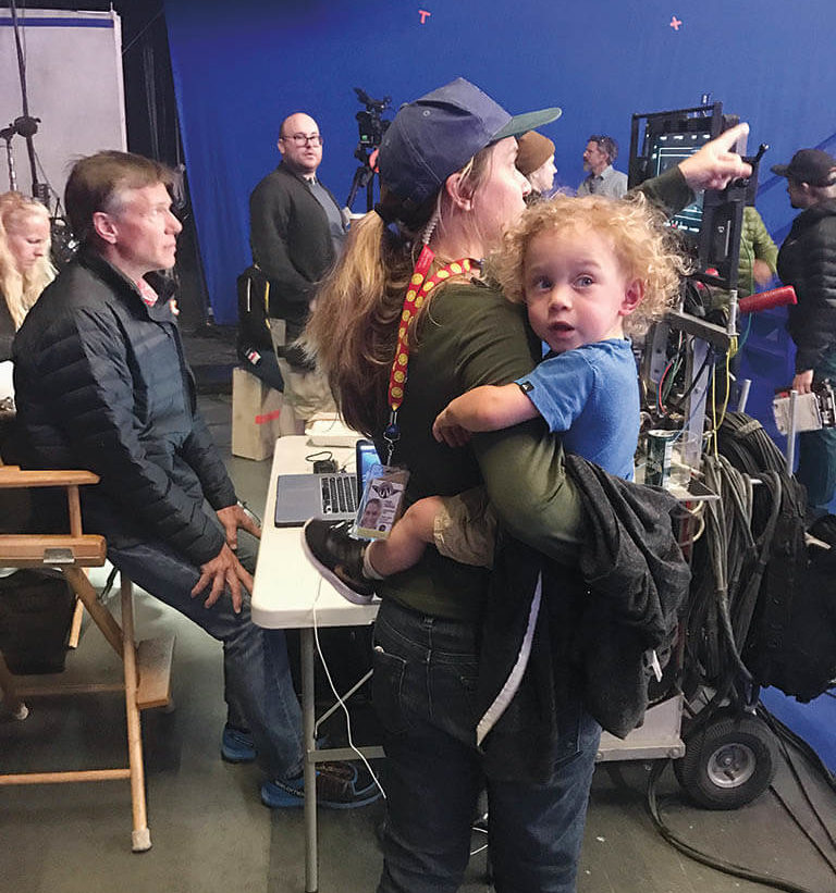 Balancing parenting and supervising visual effects work while on set of Captain Marvel. Ralla talks with stuntman Jeff Habberstad while holding baby Bodhi, who came to visit that day.