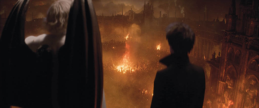 Lucifer Morningstar (Gwendoline Christie) and Morpheus (Tom Sturridge) watch as all of the demons in Hell are summoned together.