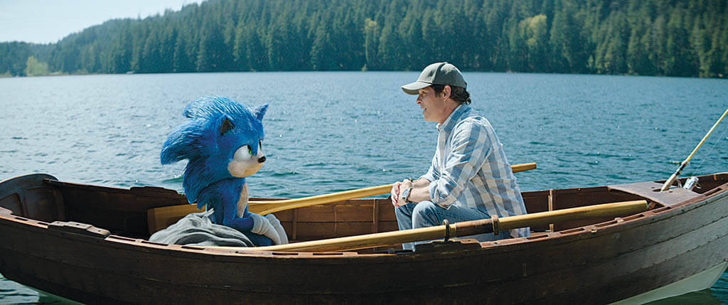 Sonic (voiced by Ben Schwartz) with actor James Marsden in a scene from Sonic the Hedgehog 2. (Image courtesy of Paramount Pictures)