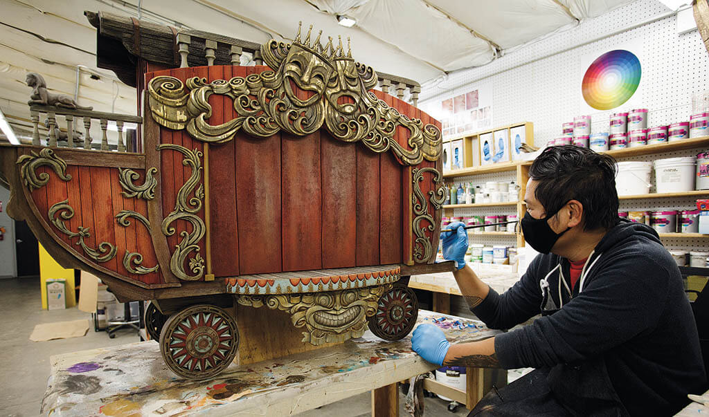 TOP AND BOTTOM: Concept art for Volpe’s wagon and the practical prop.