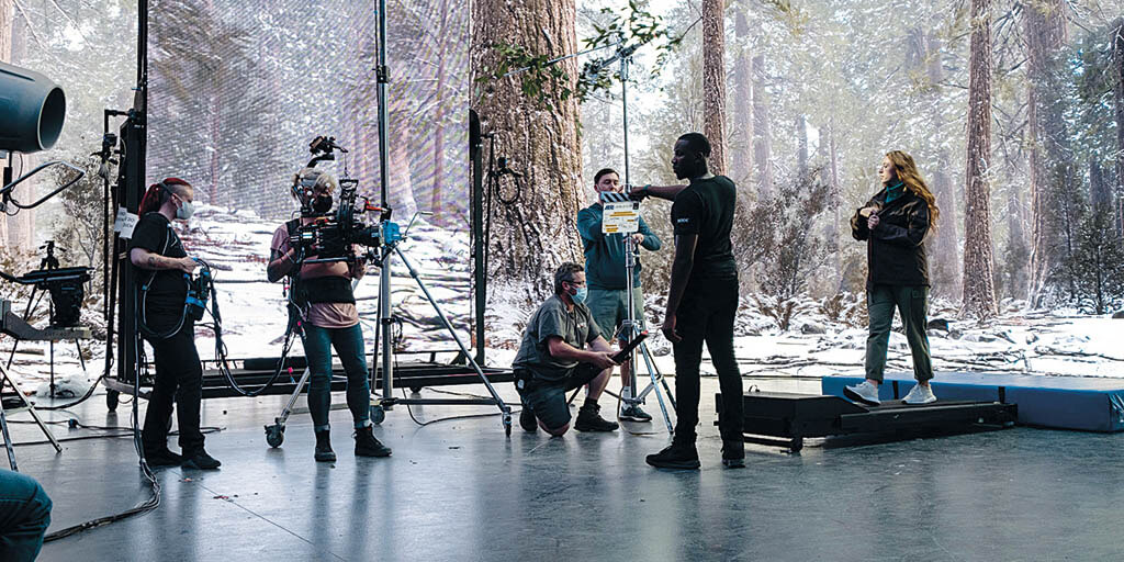 A conifer forest enlivens an LED wall in the background in the Virtual Production Innovation documentary series. (Image courtesy of DNEG)