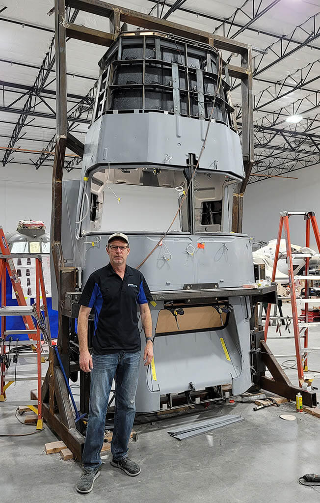 Doug Scroggins with the escape vessel.