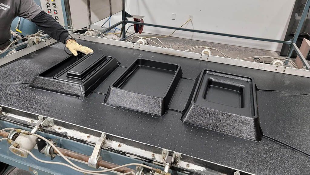 Vacuum-forming the parts. 