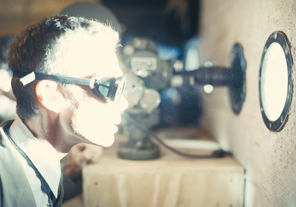 Oppenheimer, in the searing light of his creation, at the Trinity test in New Mexico. The explosion was recreated using real elements and no CGI. Nolan wanted to take the audience “in the room” when the button is pushed