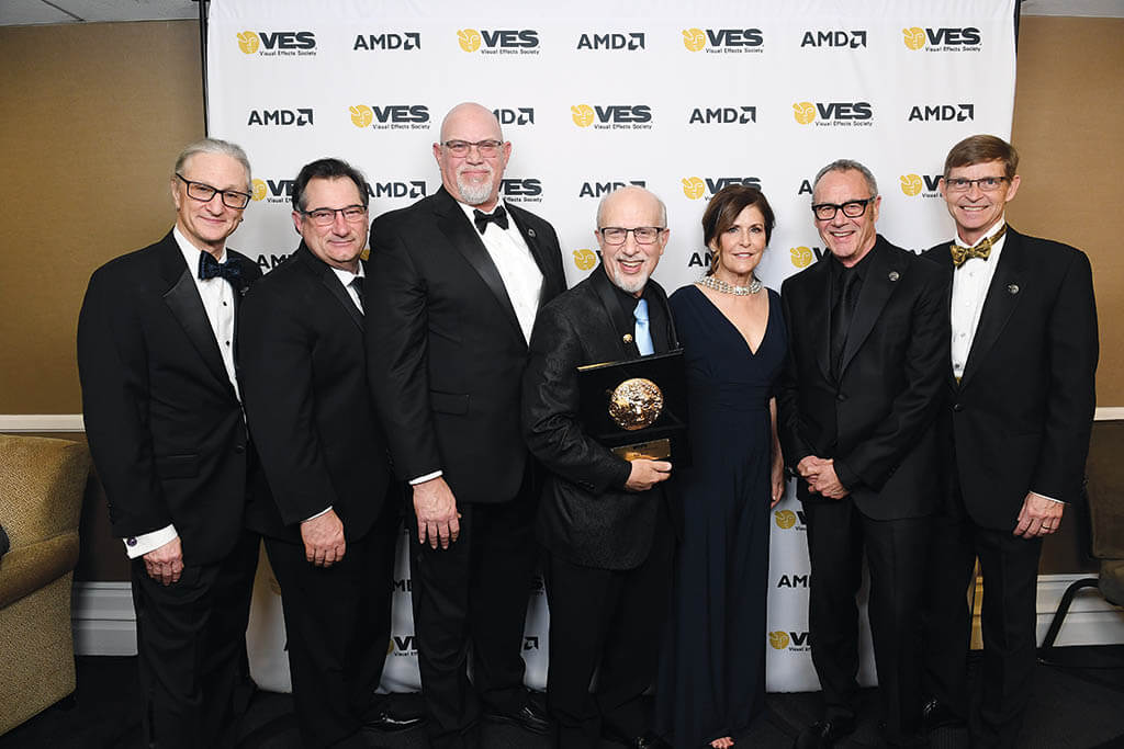 Chambers joins with the VES Chairs to honor Eric Roth with the VES Board of Directors Award at the 21st Annual VES Awards.Left to right: Jeffrey A. Okun, VES, Jeff Barnes, Chambers, Eric Roth, Lisa Cooke, Jim Morris, VES and Carl Rosendahl, VES. (Photo courtesy of the VES) 