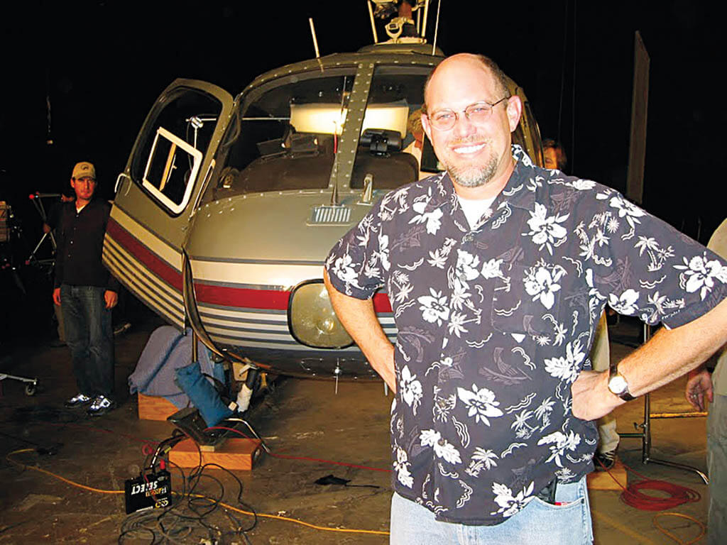 In front of a helicopter on the set of The Day After Tomorrow.