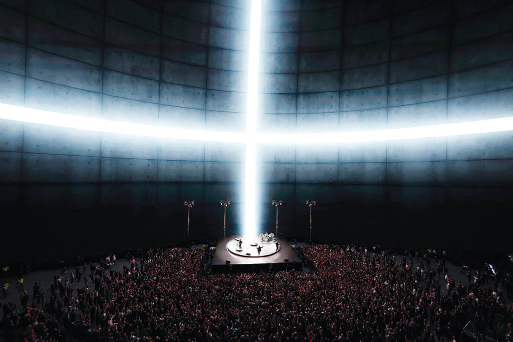 A massive cross of light is a simple but powerful visual at this scale, part of the band’s “U2: UV Achtung Baby Live at Sphere” residency. (Photo Kevin Mazur. Courtesy of disguise and U2)