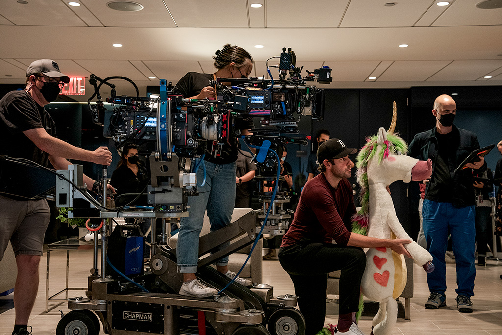 Director John Krasinski ready on set with the Unicorn model for positioning purposes with Ryan Reynolds, to be replaced by the animated character. Krasinski served as director, writer, producer and had a starring role in the film.