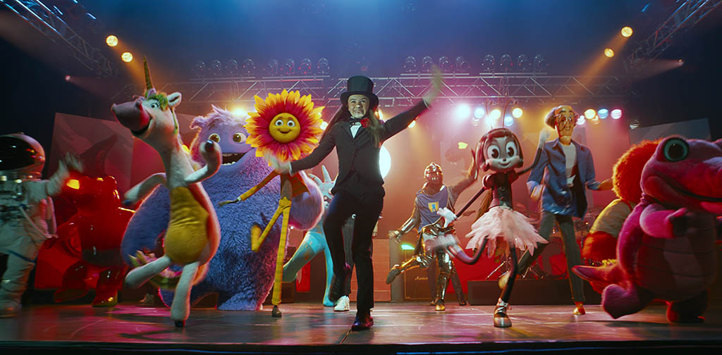 One of the most challenging sequences to capture was the big dance sequence, which filmmakers executed in postvis. Because the sequence was performance animation, the characters needed to breathe for a moment, extending shots to let the emotional impact sink in. From left: George Clooney (Spaceman), Amy Schumer (Gummy Bear), Emily Blunt (Unicorn), Steve Carell (Blue), Matt Damon (Flower), Cailey Fleming (Bea), Phoebe Waller-Bridge (Blossom), Richard Jenkins (Art Teacher) and Maya Rudolph (Ally).