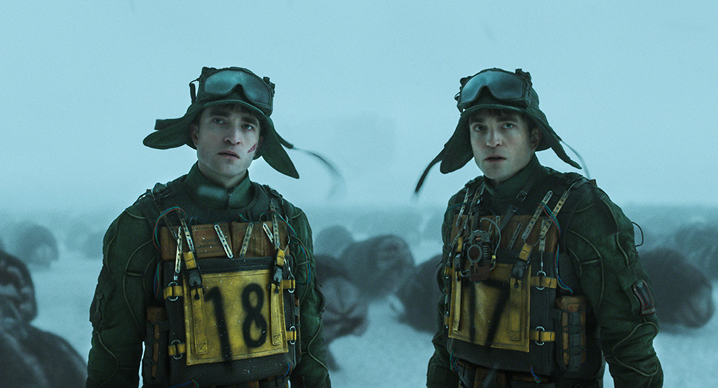 Robert Pattinson portrays multiple versions of himself, which at times share the screen with each other. 