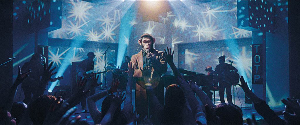 One of the most complex musical numbers in Better Man is “Rock DJ,” which required LiDAR scans of Regent Street and doing full 3D motion capture with the dancers dancing down the whole length of the street to work out how best to shoot it. (Image courtesy of Paramount Pictures)