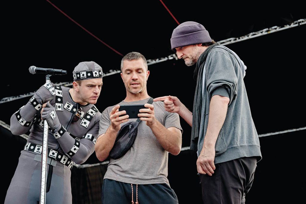 Motion capture is visually jarring because your eye is always drawn to the performer in the mocap suit, but it worked out well on Better Man because the same thing happens when he gets replaced by a CG monkey. (Image courtesy of Paramount Pictures)