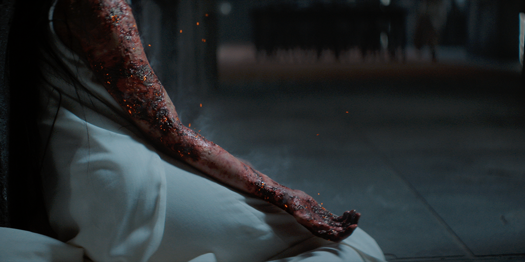 Contributing to the gruesomeness of the characters being burned alive are the flying embers and sparks being emitted by their skin.