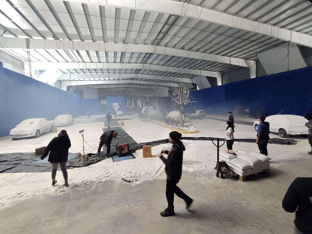500 tons of artificial snow were shipped in and digitally augmented.