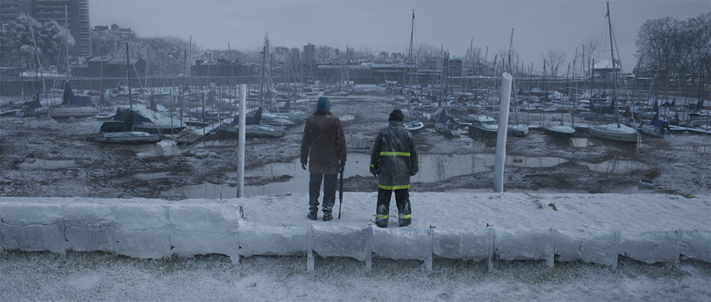 An iconic moment from the graphic novel was recreated by turning a harbor with boats into a frozen wasteland. 
